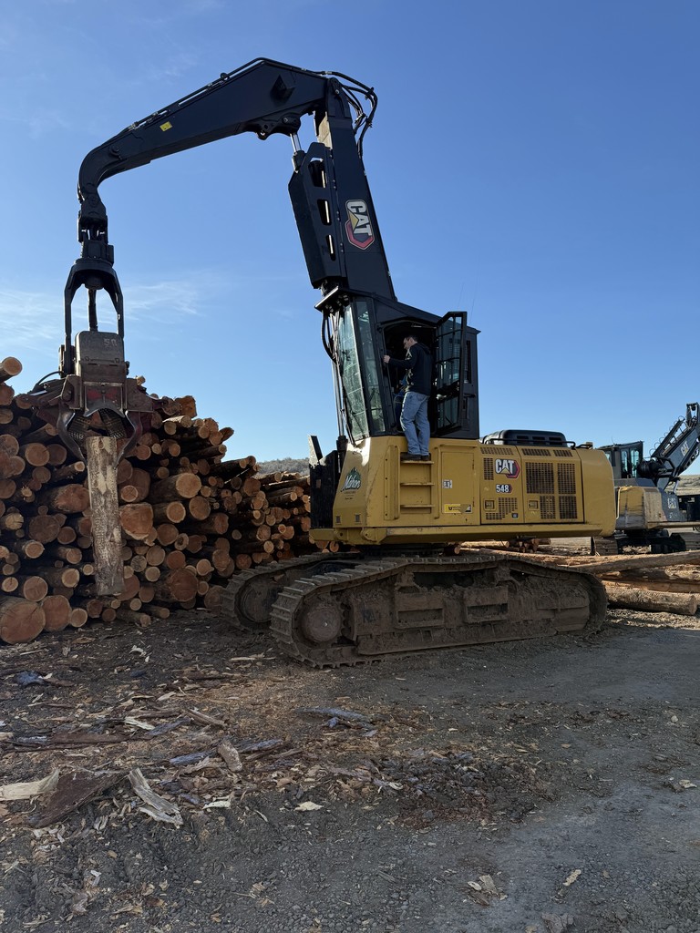 students and logging equipment
