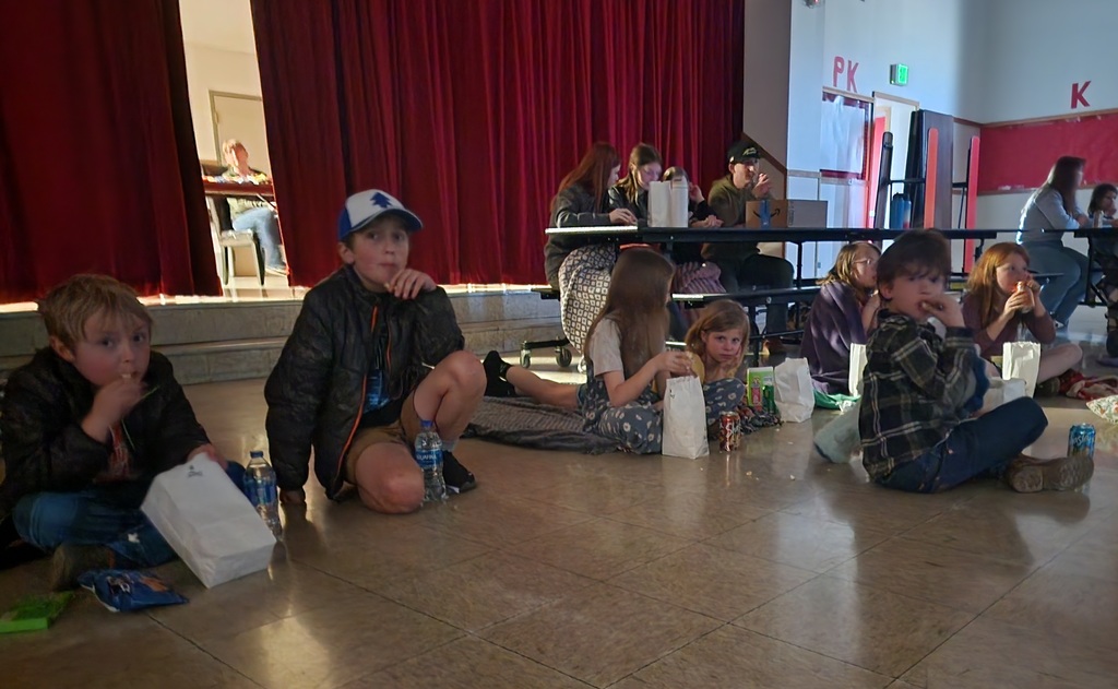 kids eat popcorn at a movie night