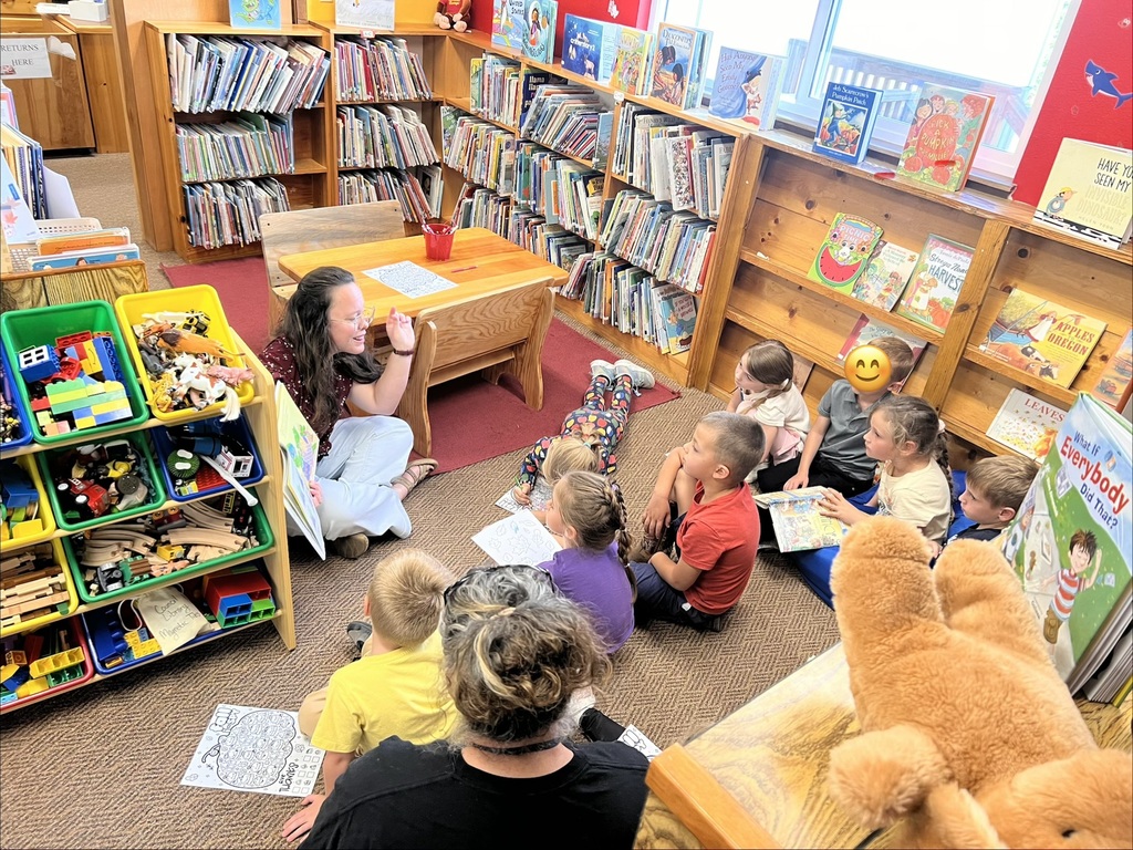 Librarian reads to children