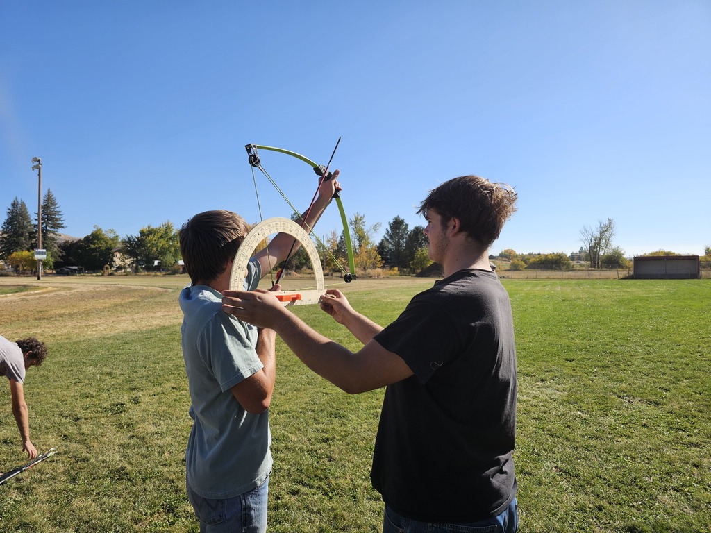 Physics student using bows to learn physics
