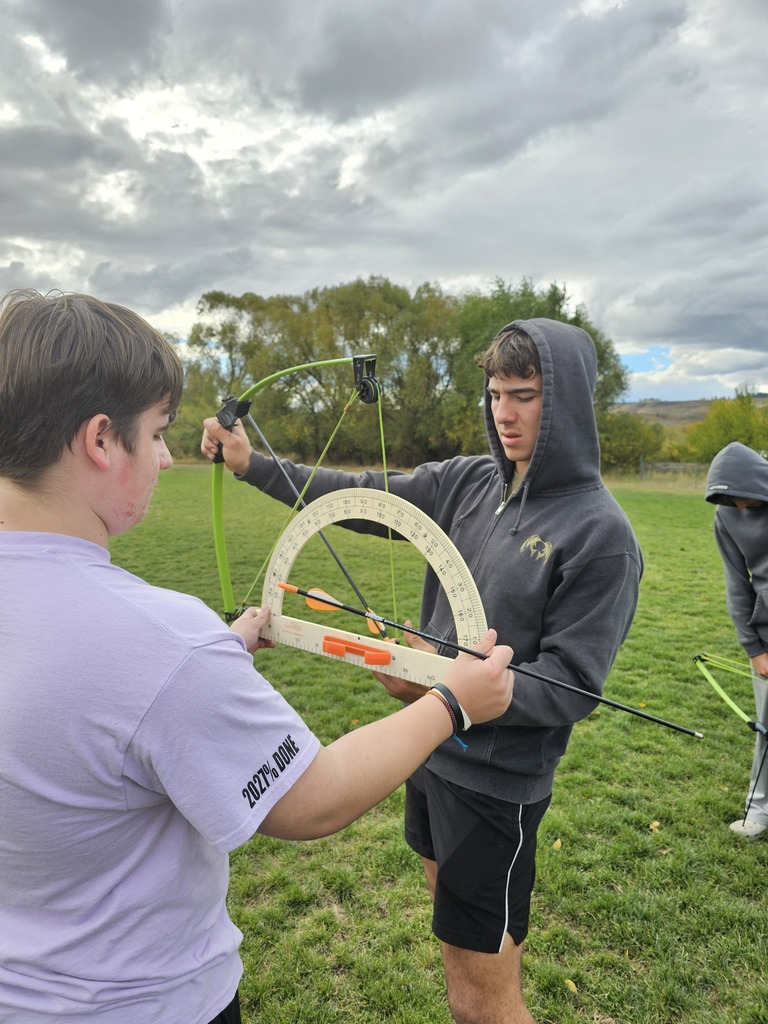 Physics student using bows to learn physics