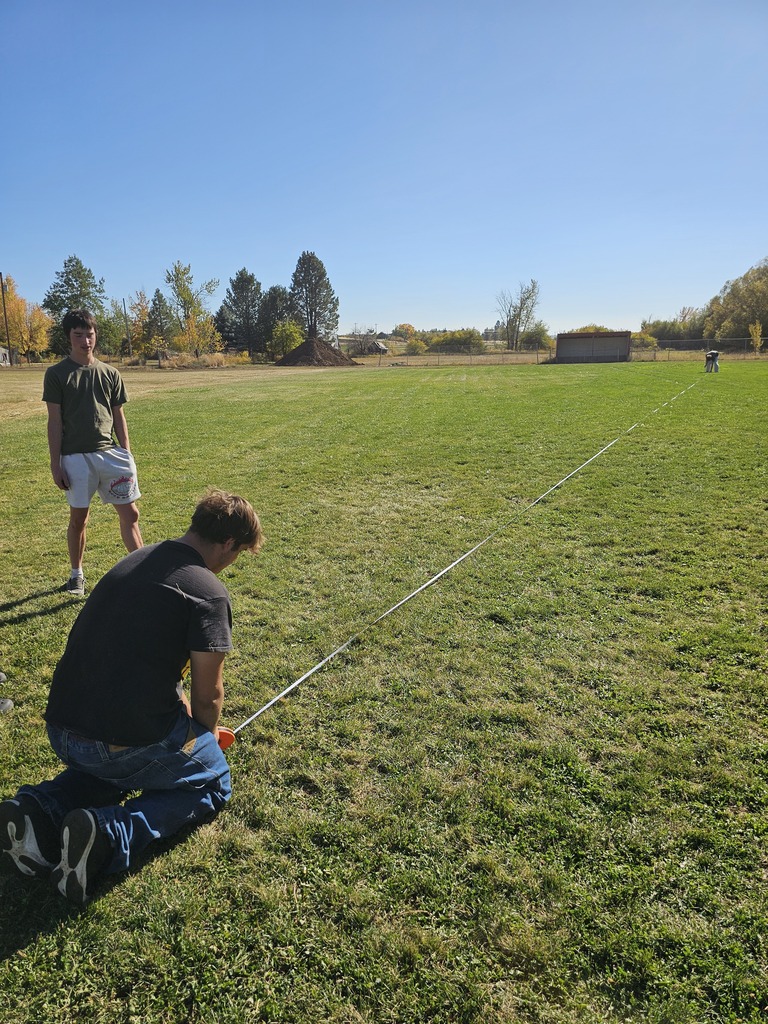 Physics student using bows to learn physics