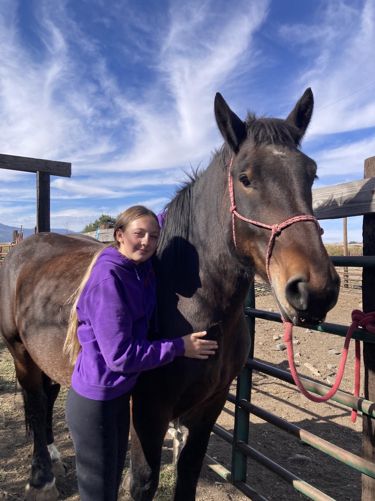 student with her horse