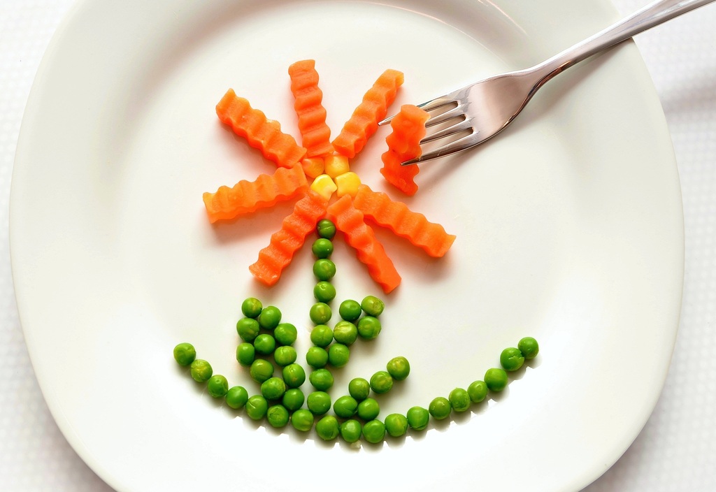 carrots and peas in shape of flower