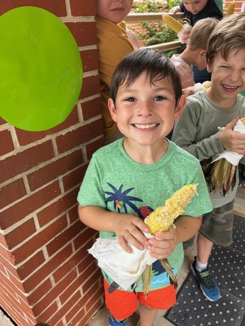 enjoying roasted corn