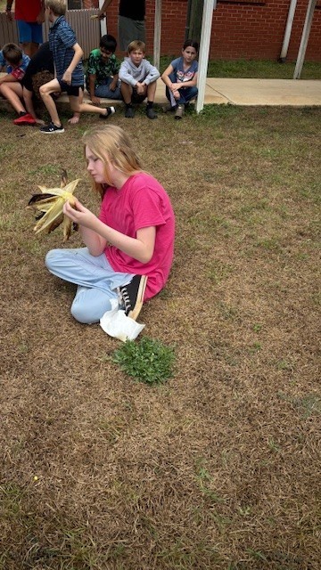 enjoying roasted corn