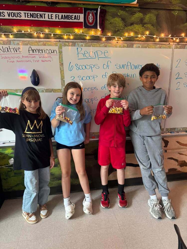 Kids holding bags of trail mix