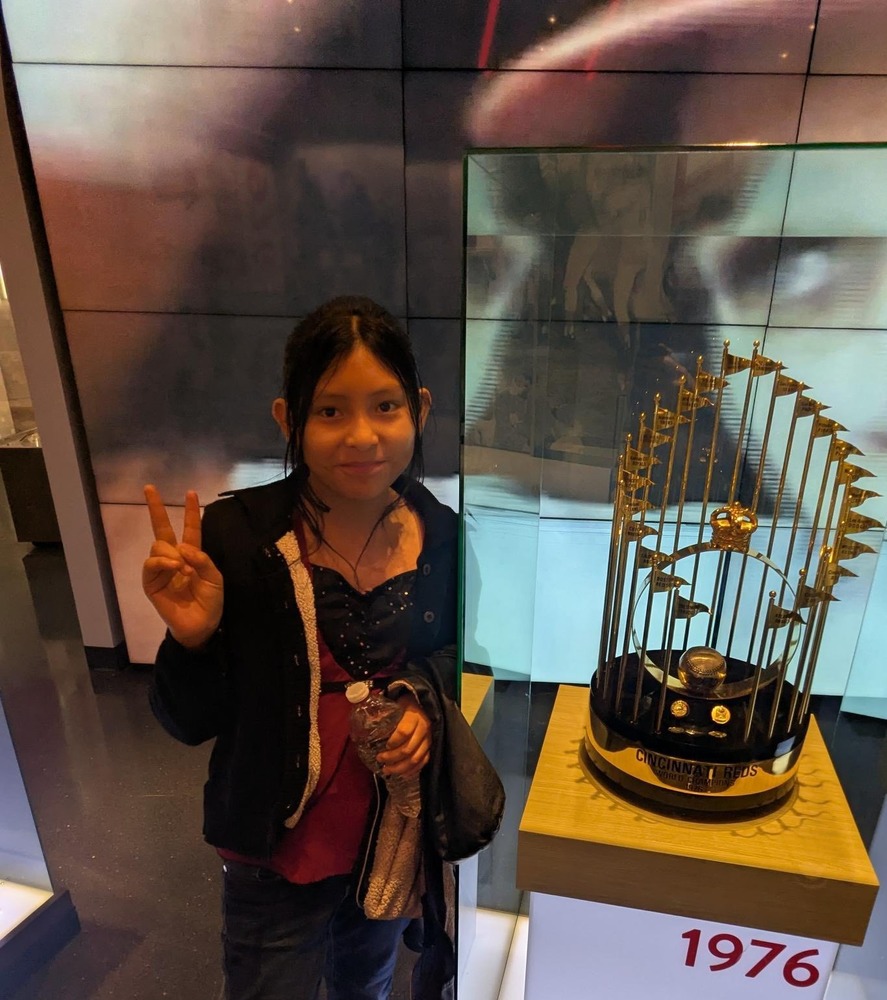 Girl next to trophy