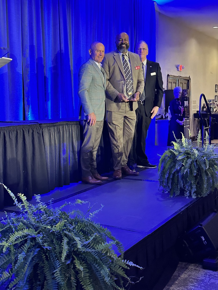 Alvin Garrison receiving award