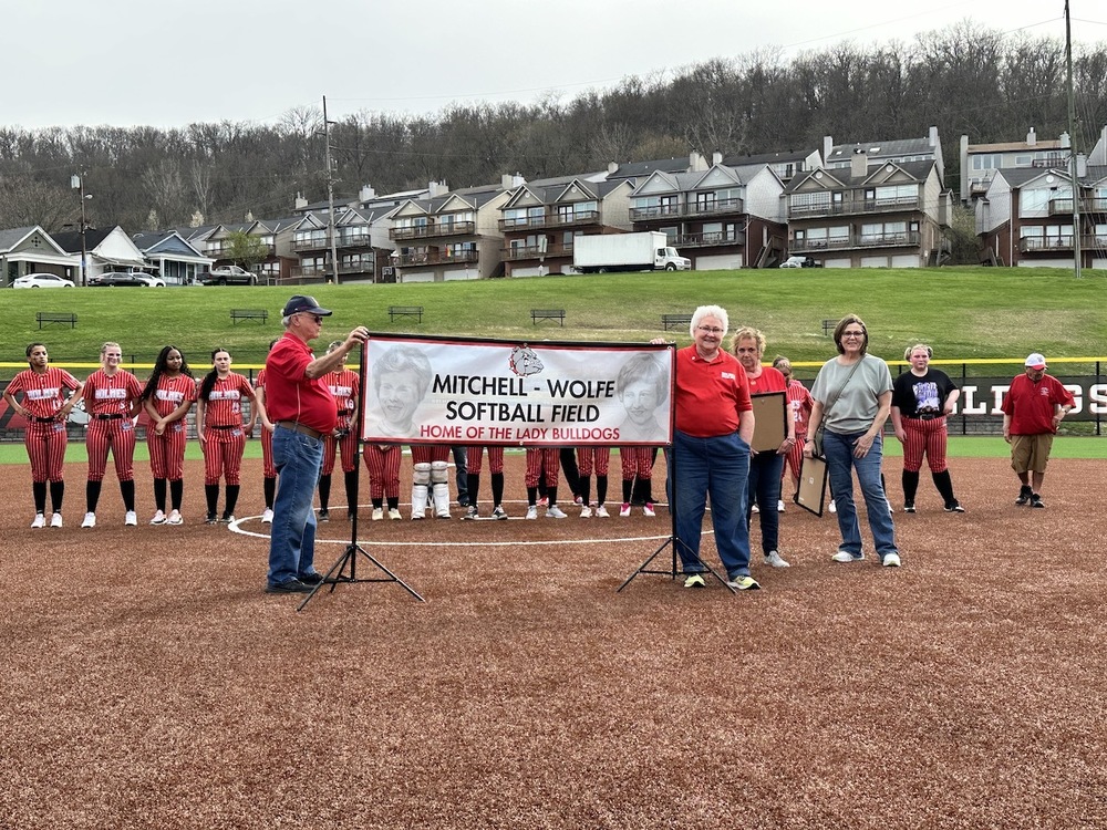 new sign unveiled at softball field says Mitchell-Wolfe Field