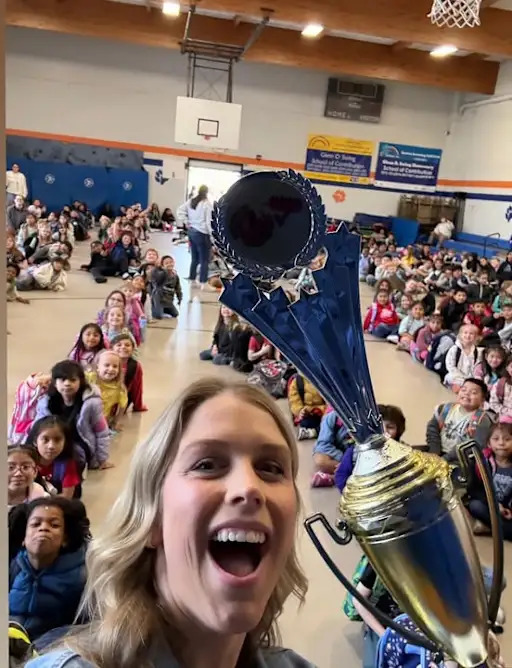 Principal Peach with attendance trophy