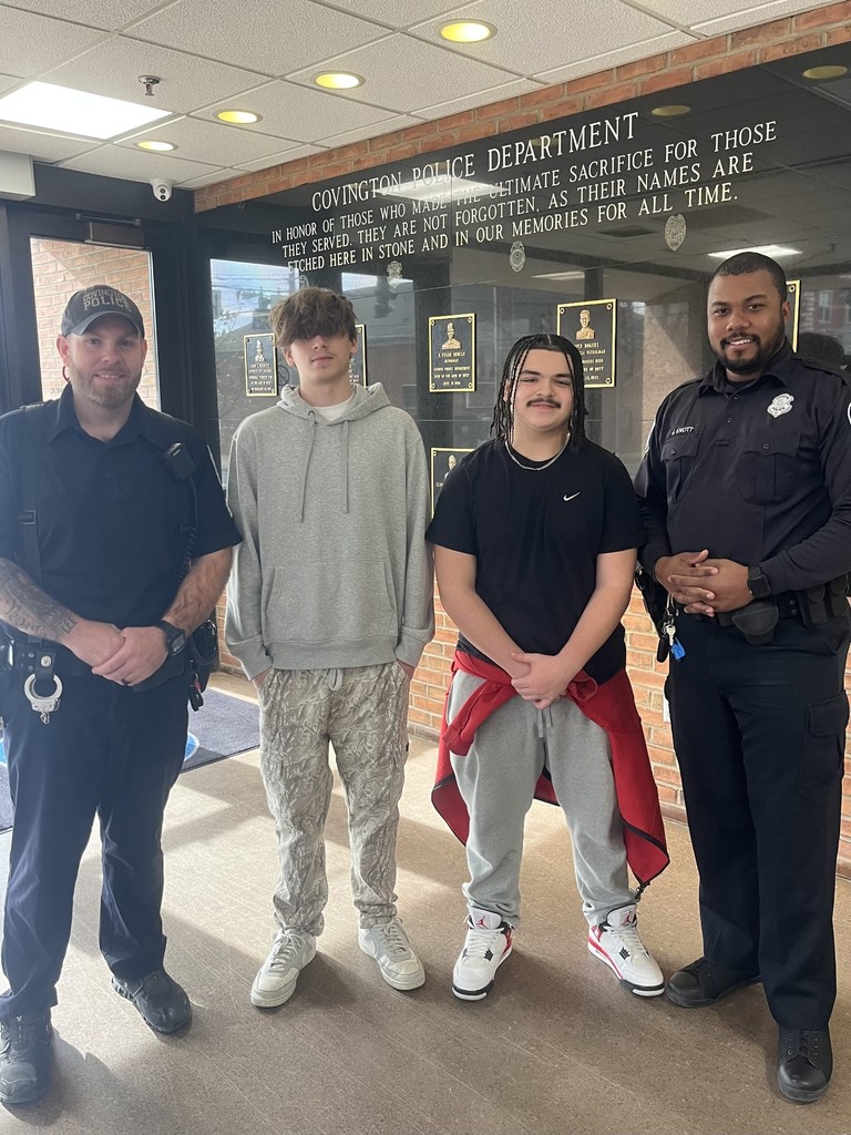 Work Based Mentee students standing alongside Covington Police Department officers