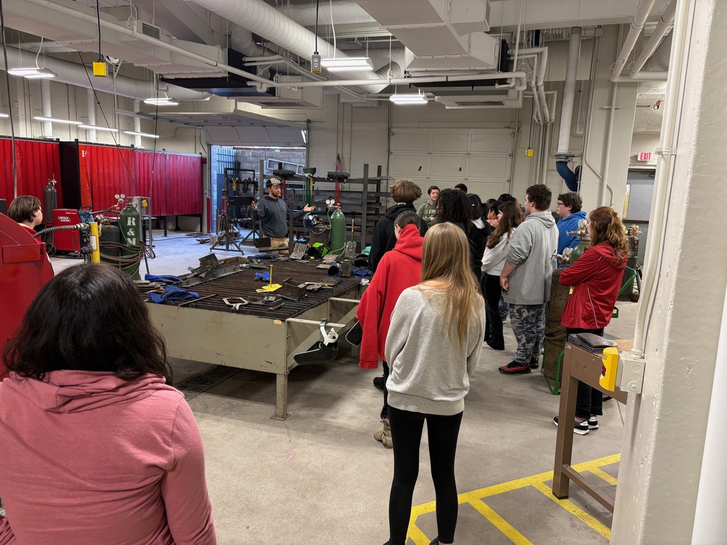 A freshman class listening to Kyle Thornton, welding instructor, give a speech on welding.