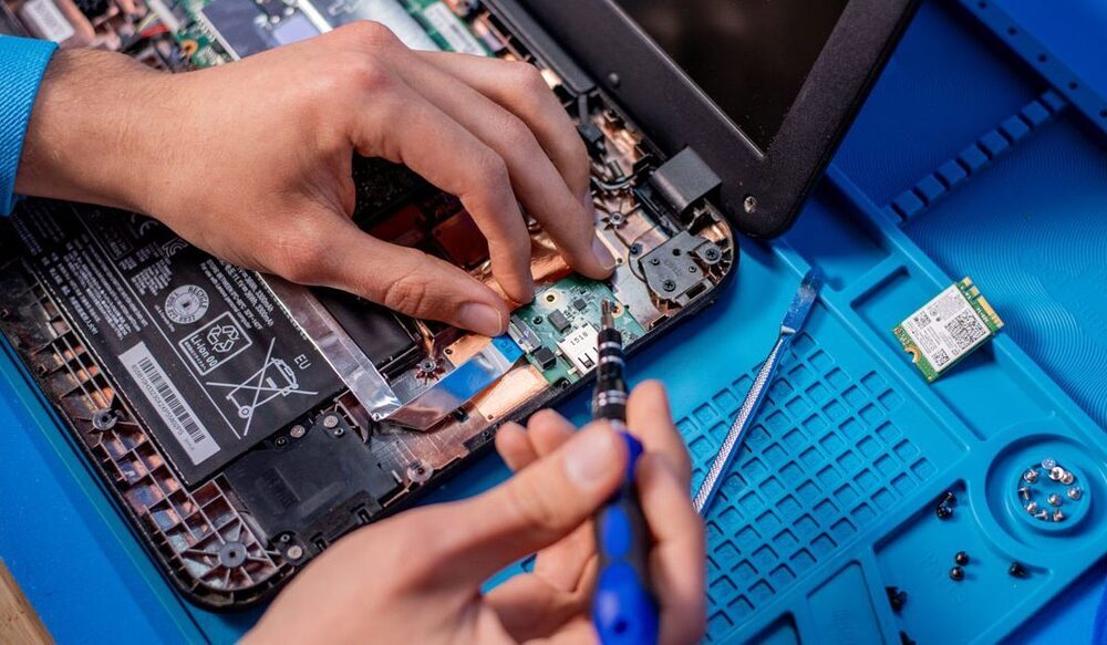 Chromebook device on a workbench being repaired