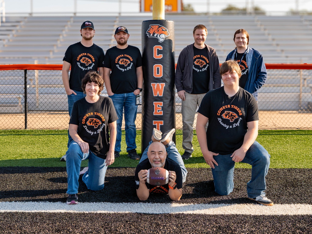 IT team photo on football field
