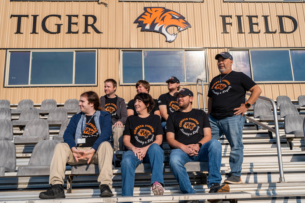 IT team photo on football field