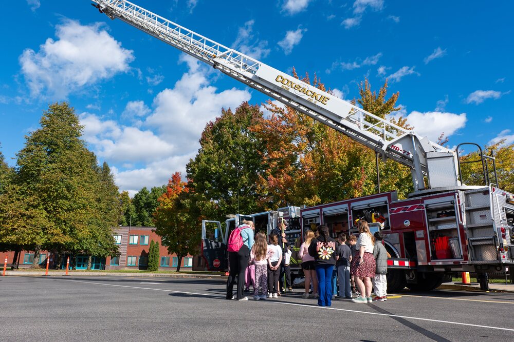 Fire truck with students around it