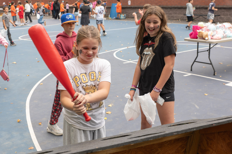 students playing whack a mole