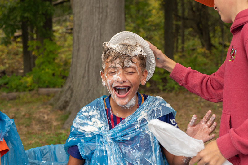 student getting pie in face