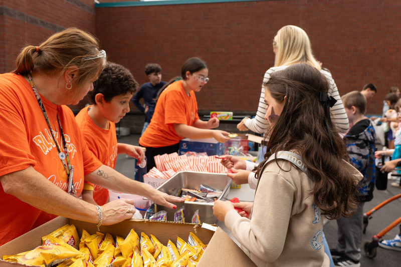 students picking out their candy and food prizes