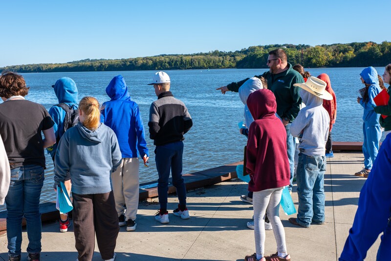 Students looking out on the river