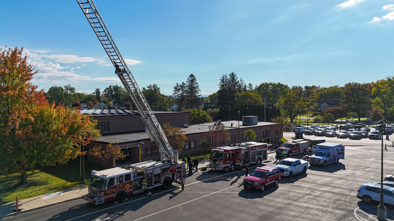 drone shot of the emergency vehicles in the parking lot