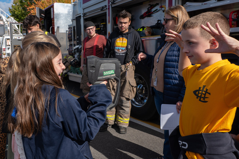 students using fire fighter gear