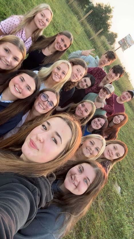 groups of seniors standing outside at sunrise