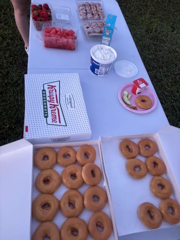 krispy kreme donut sitting on a white table