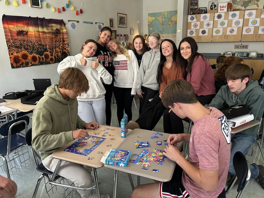 high school social studies map race with students giving a thumbs up