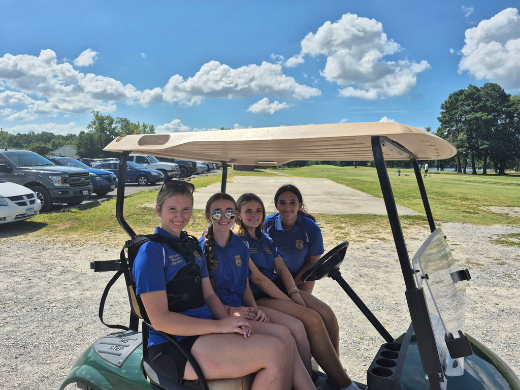 High School girls in a golf cart