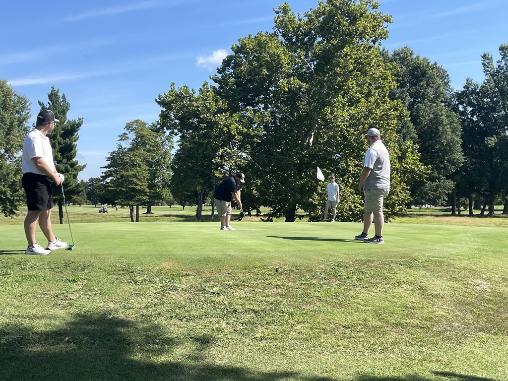 Men playing golf