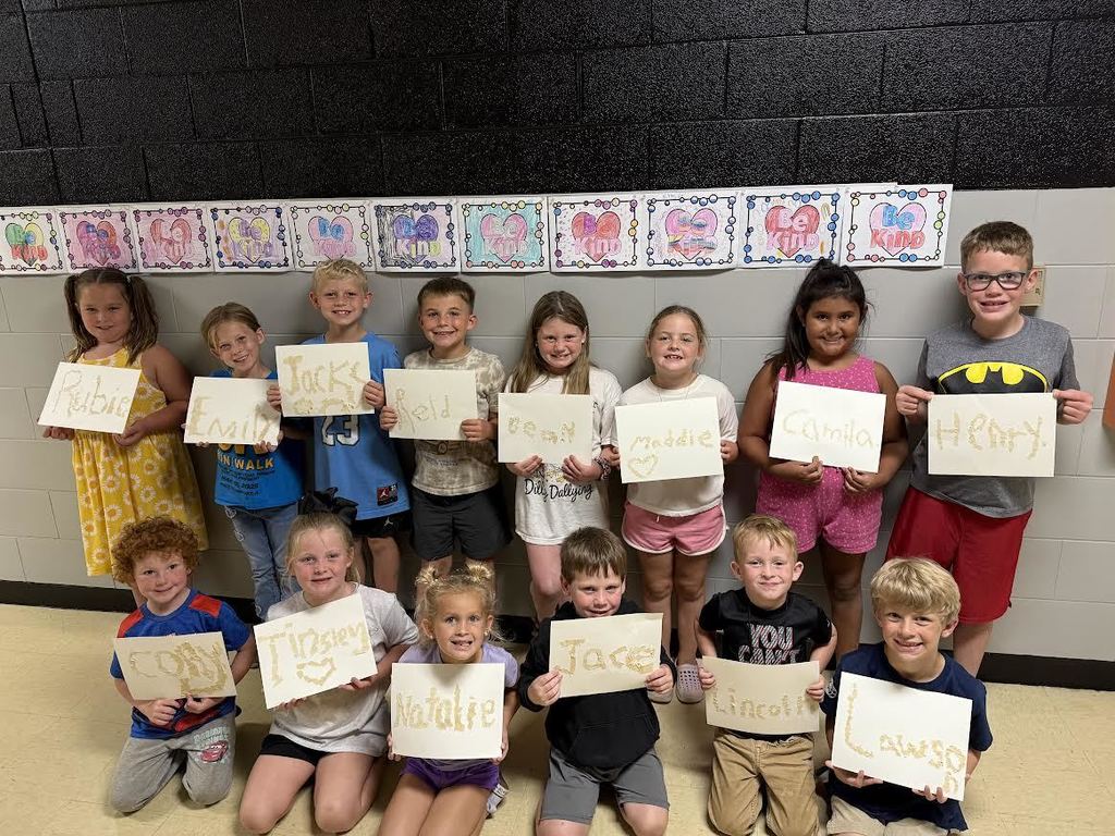 kindergarten through 3rd graders showing their painting skills