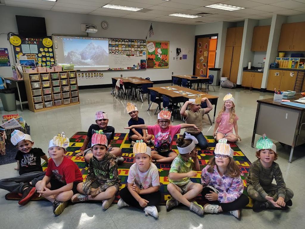 Kindergarten students in pumpkin hats