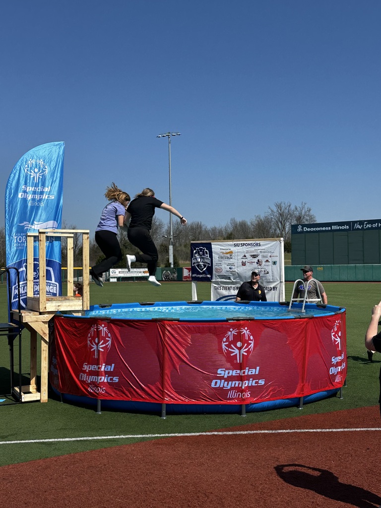 Students jumping in pool