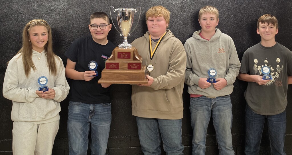 4 junior high boys and 1 junior high girl holding a large trophy and small individual trophies