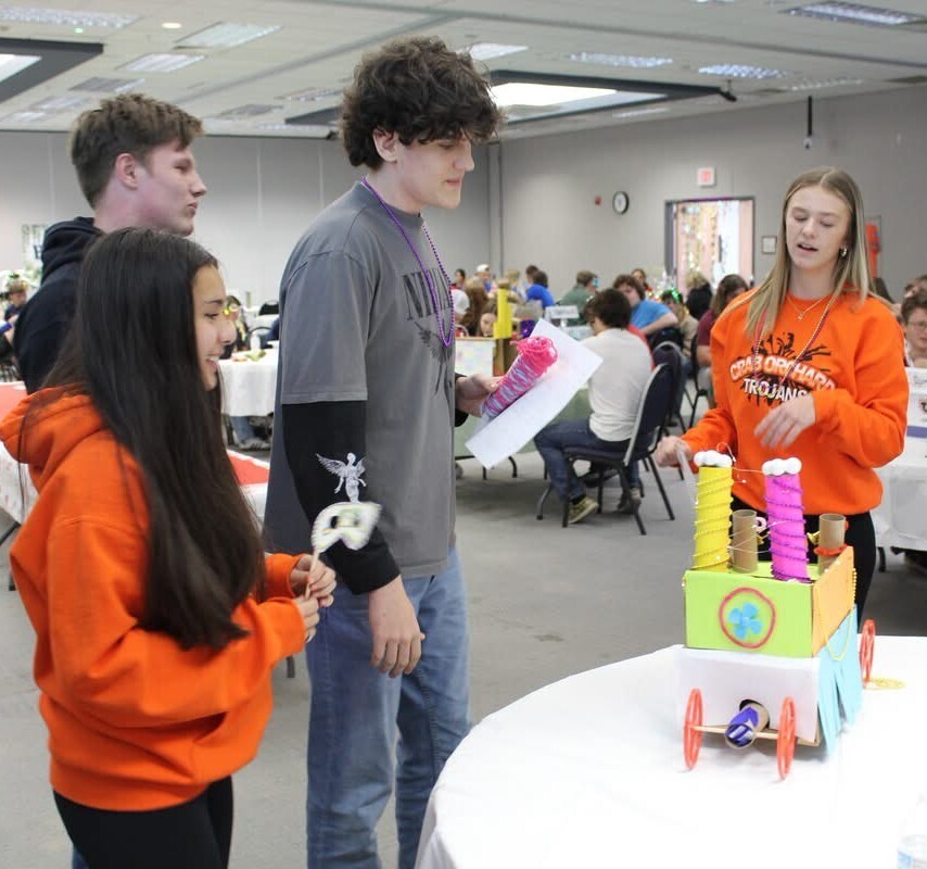 High School students with a model of a float