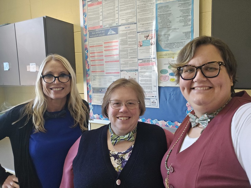 3 ladies showing off bowties