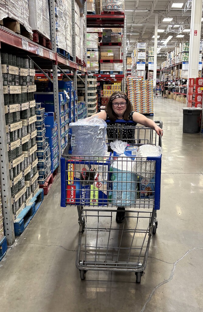 Lifeskills student with a basket of store items