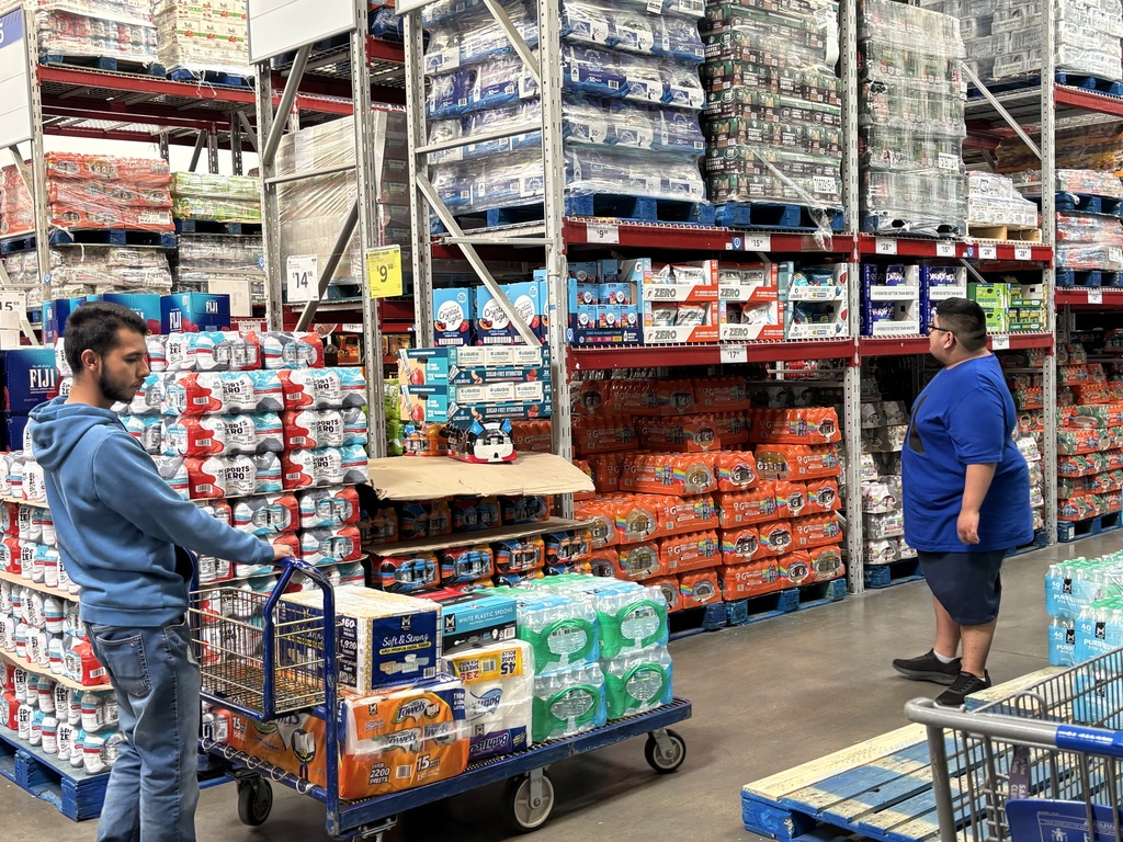 Lifeskill students loading a cart of items at Sam's