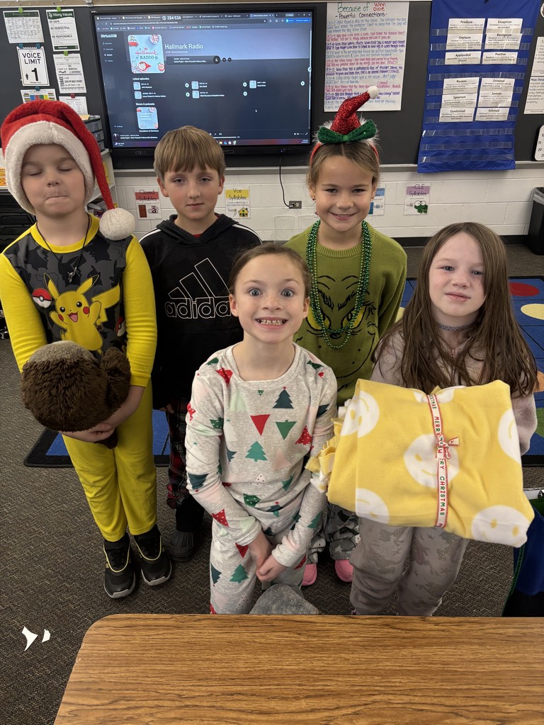 3rd grade students making tie blankets for their "giving celebration" 