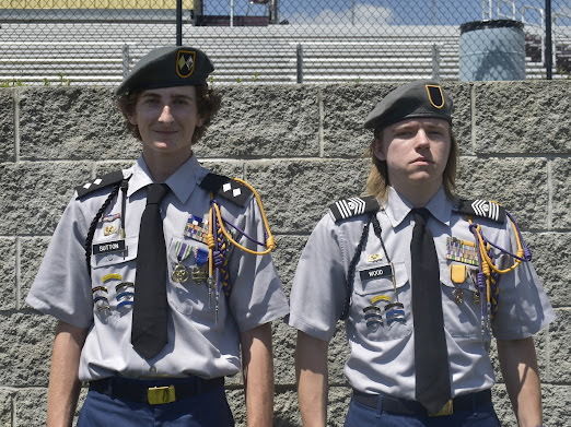 two students pose for photo