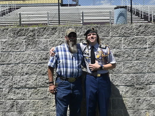 student and parent pose for photo