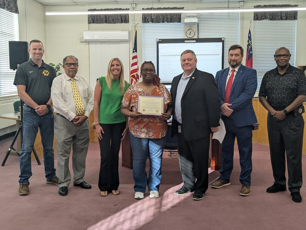 7 Adults Standing with Certificates 