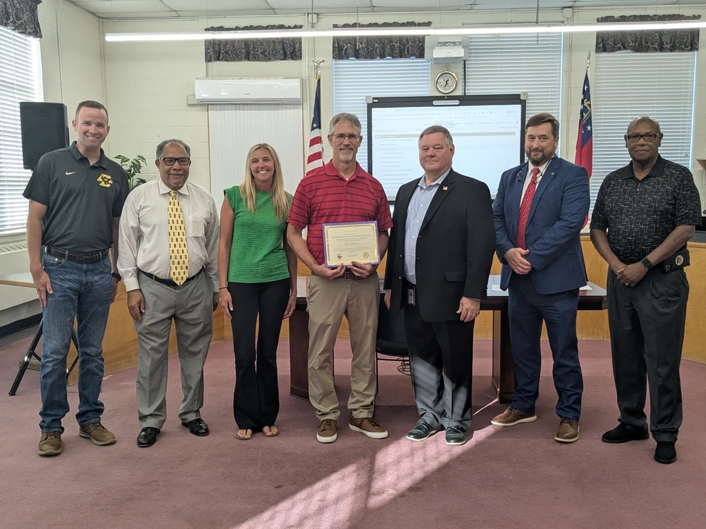 7 Adults Standing with Certificates 