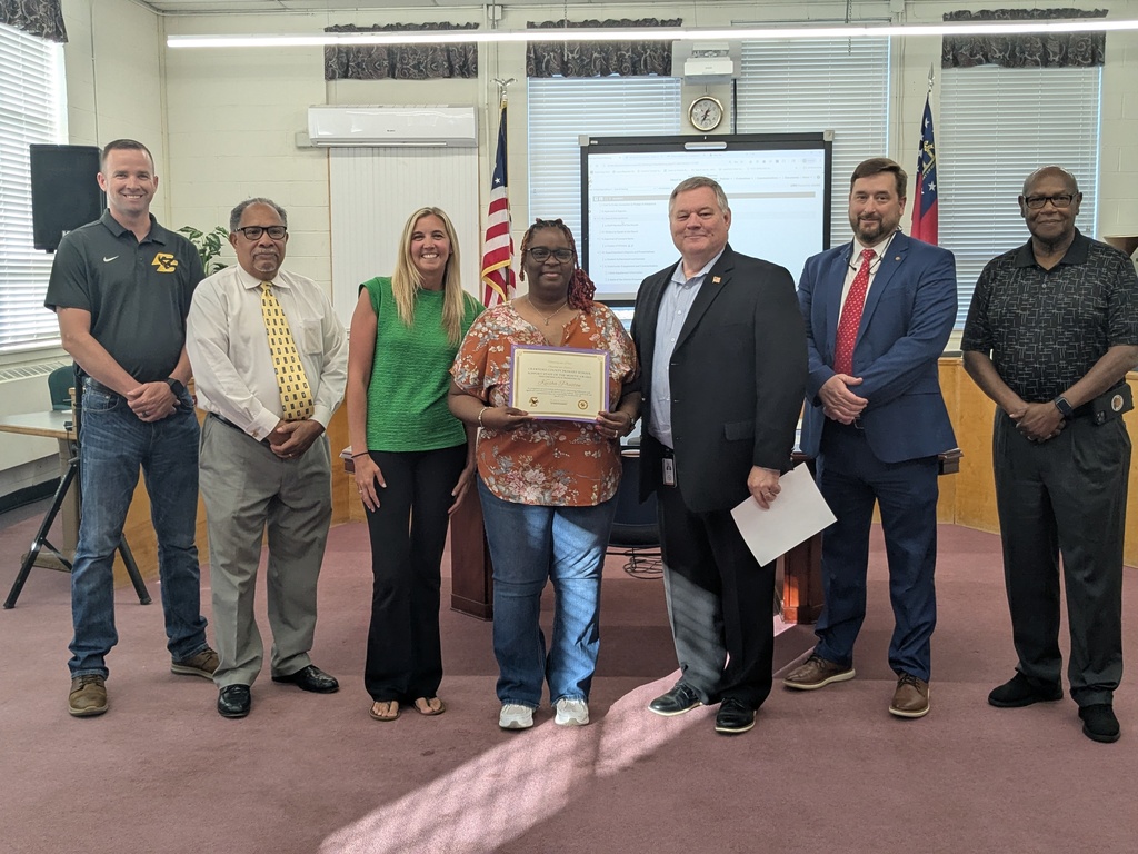 7 Adults Standing with Certificates 