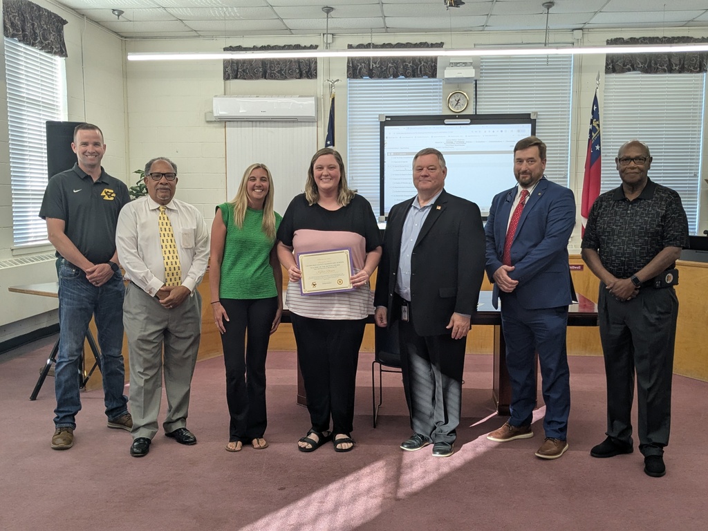 7 Adults Standing with Certificates 