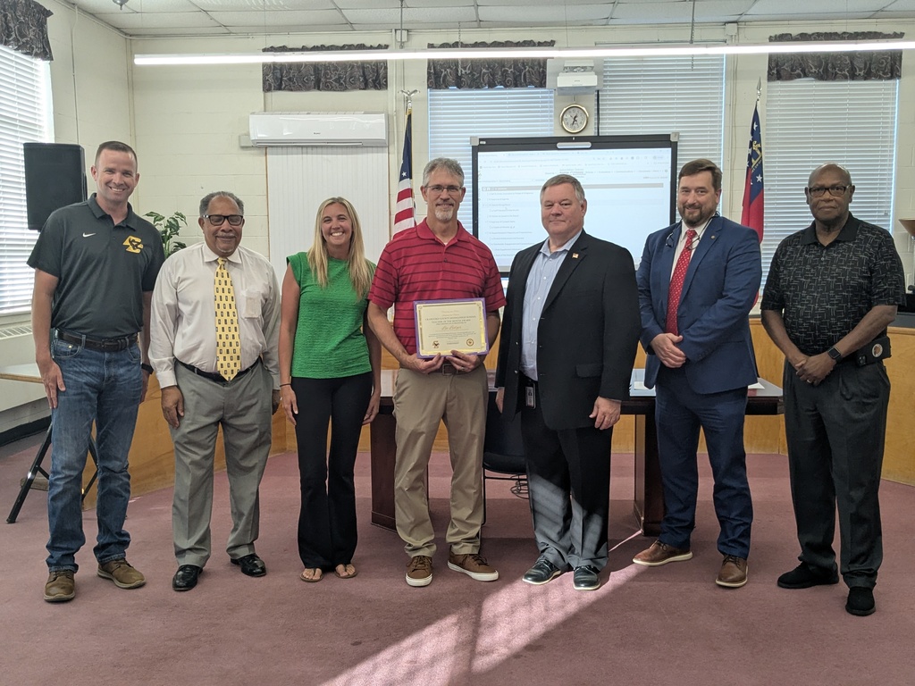 7 Adults Standing with Certificates 