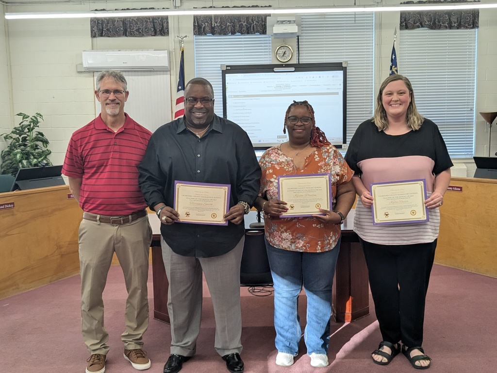 4 Adults Standing with Certificates 