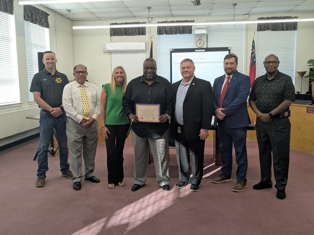 7 Adults Standing with Certificates 